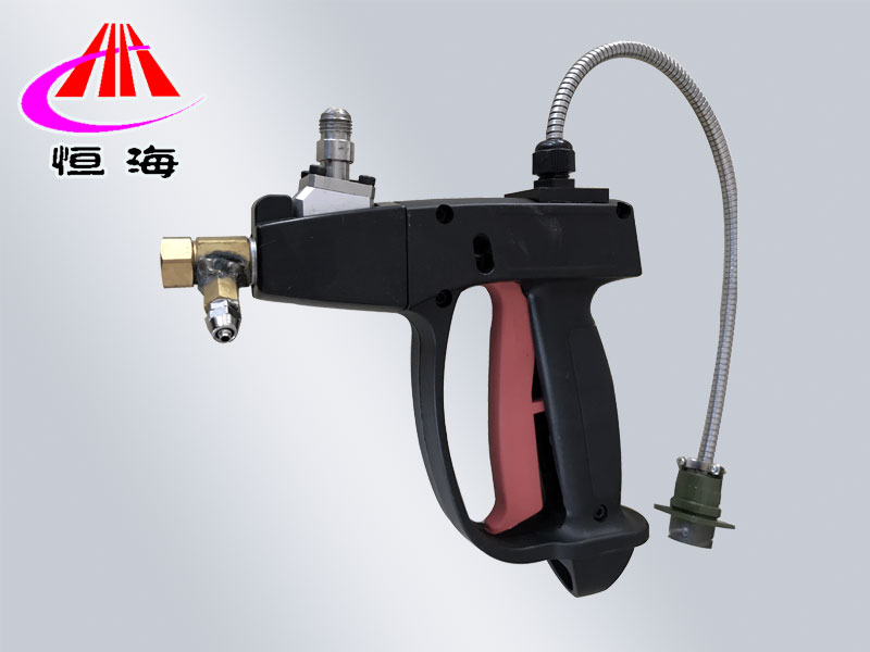 Hand held spiral spray gun